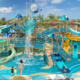 Im Sommer 2026 wird die Privatinsel Great Stirrup Cay der Norwegian Cruise Line auf den Bahamas auch einen 9.000 Quadratmeter großen Wasserspielbereich für Kinder im Great Tides Waterpark mit acht Minirutschen und einem überdimensionalen Kippeimer sowie weiteren interaktiven Wasserattraktionen bieten (Rendering Norwegian Cruise Line)