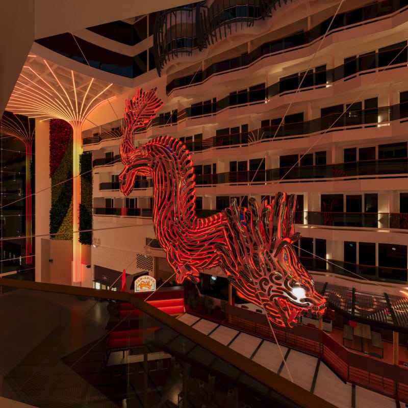 Drachenskulptur der MSC World Asia im Fokus, leuchtend rot und beeindruckend groß.